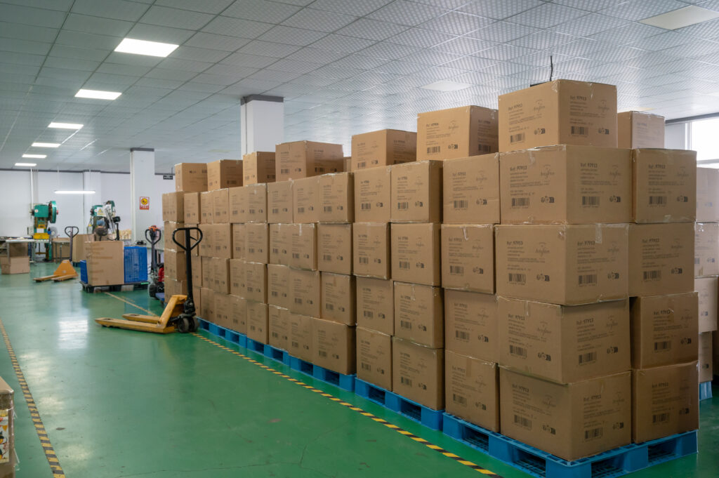 Finished goods warehouse of Cedar Paper, a professional paper tableware manufacturer, showing bulk storage of custom paper napkins, plates, and cups ready for global shipping.