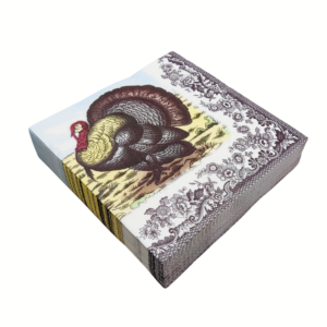 Elevate your Thanksgiving table with our vintage turkey paper napkins. Featuring a classic harvest turkey illustration framed by an ornate black floral border, these disposable napkins add timeless charm to your holiday feast.